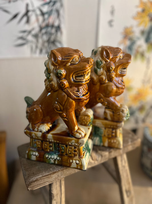 Pair of ceramic glazed brown Lion statues