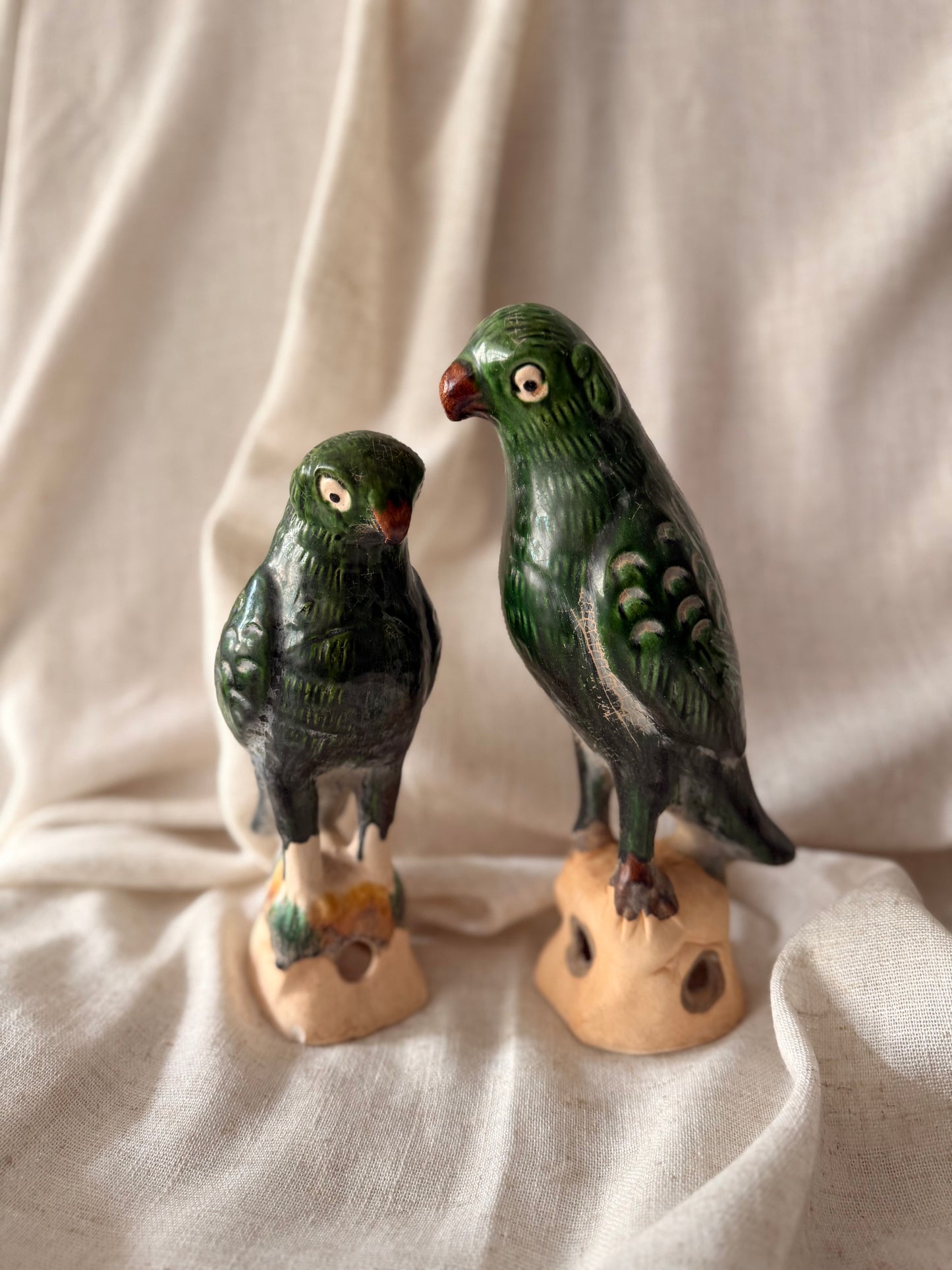 Pair of green glaze parrots