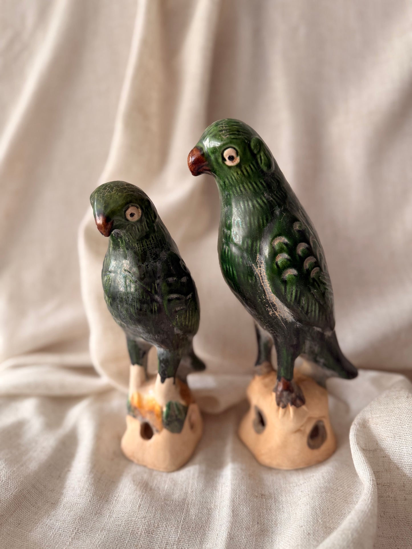 Pair of green glaze parrots