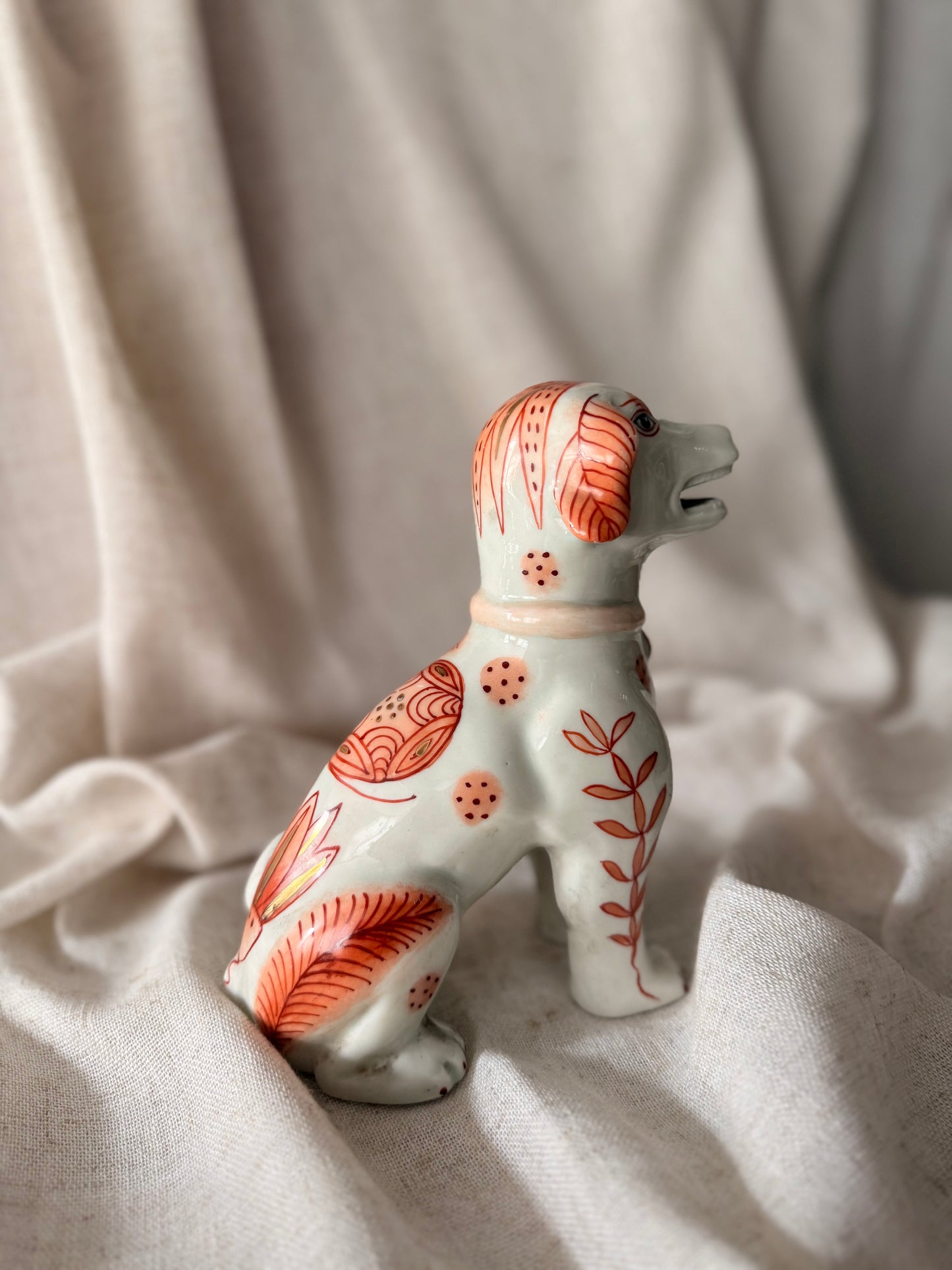 Hand painted in HK fine ceramic dog statue
