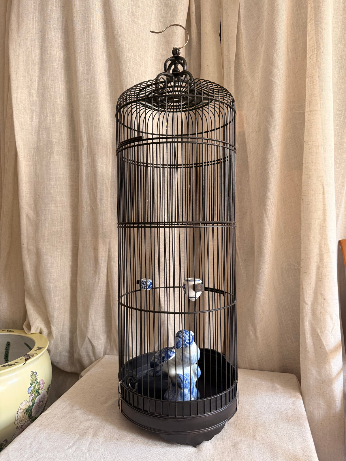 Bamboo bird cage & blue ceramic Parrot Statue