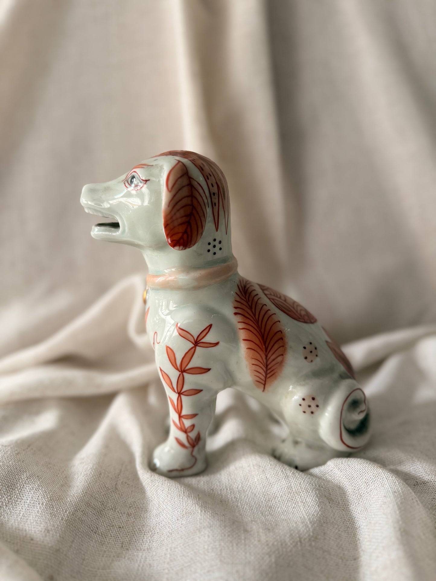 Hand painted in HK fine ceramic dog statue