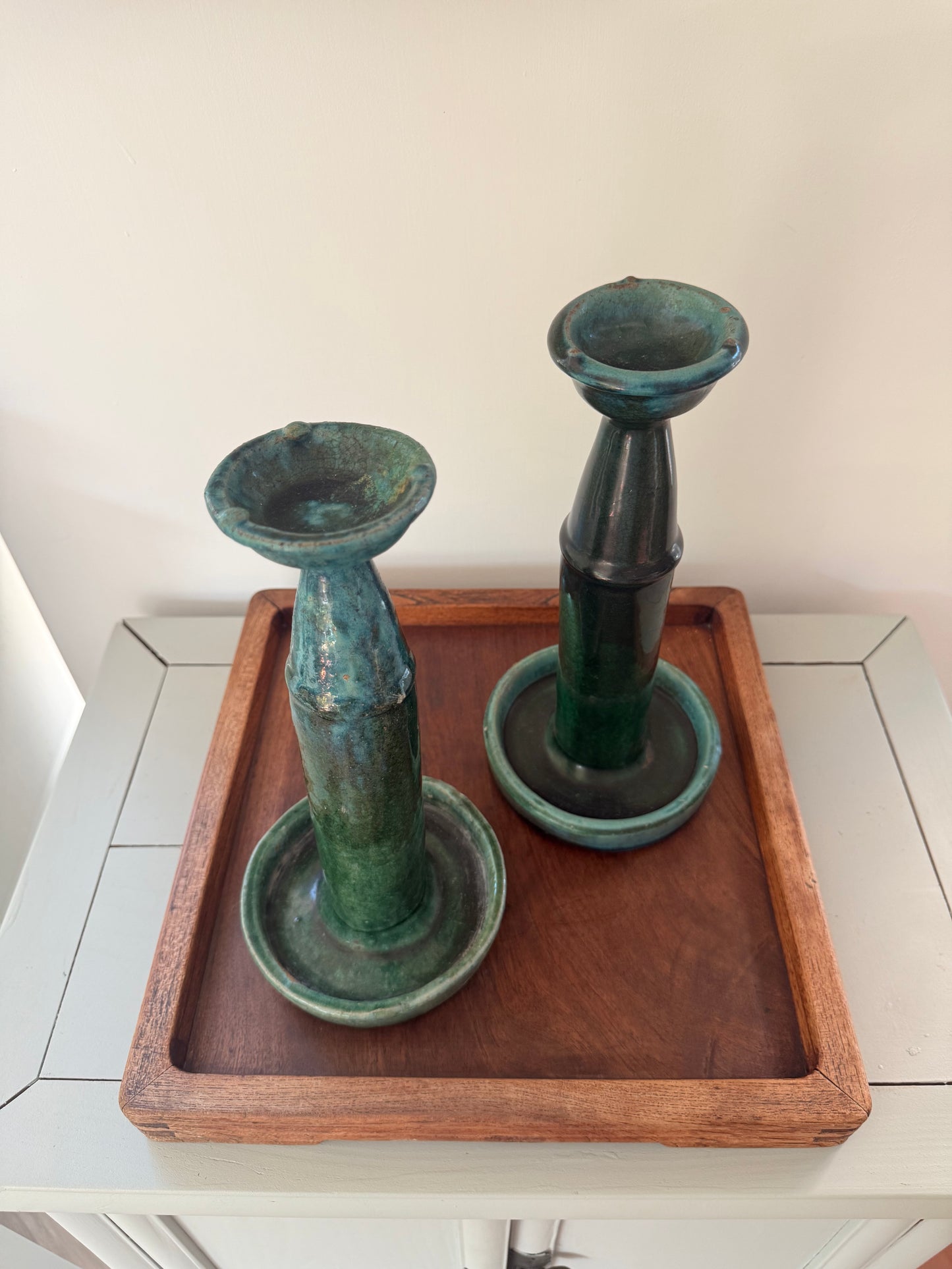 Tall pair of green glazed antique oil lamps