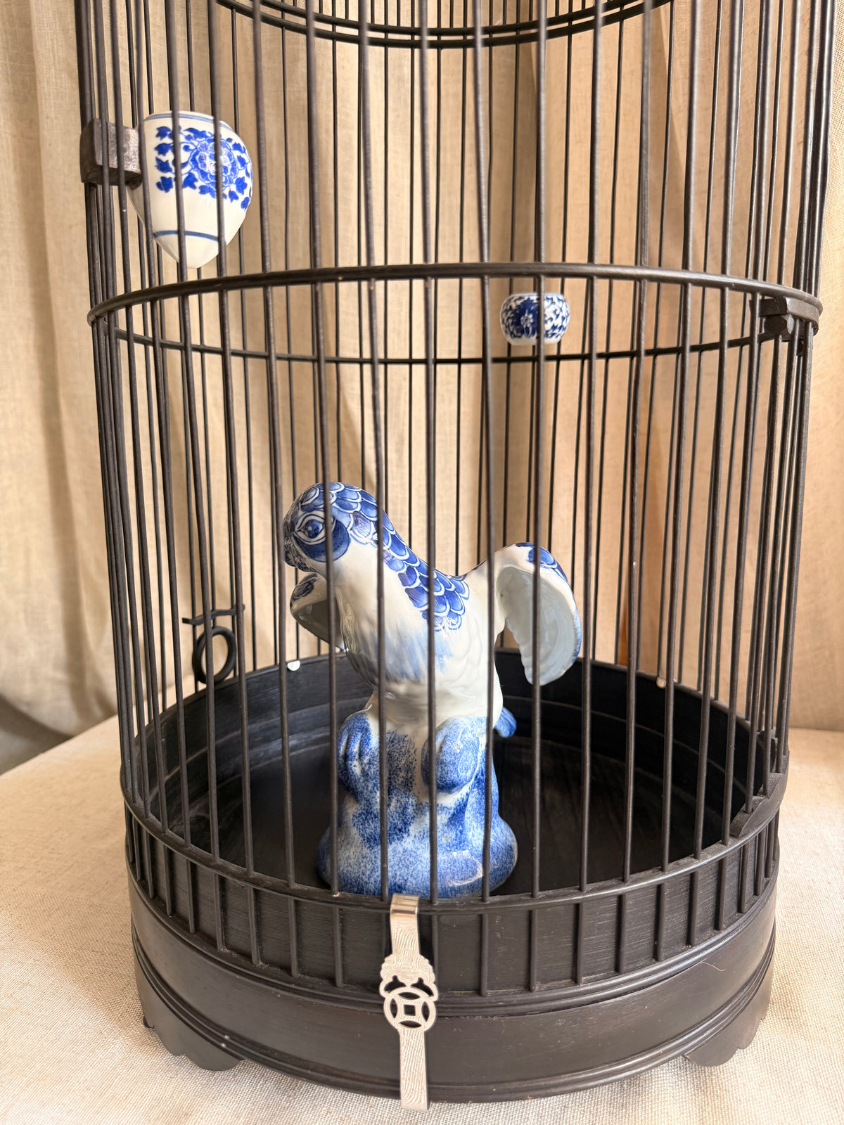Bamboo bird cage & blue ceramic Parrot Statue